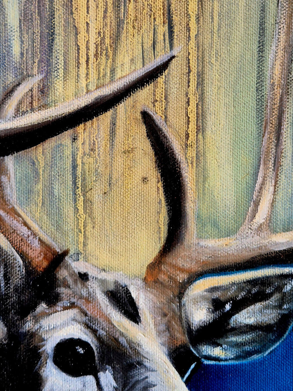 "Detail of a stag's face and antlers with intense gaze, close-up of original painting Touched by the Light by Annikaprana"