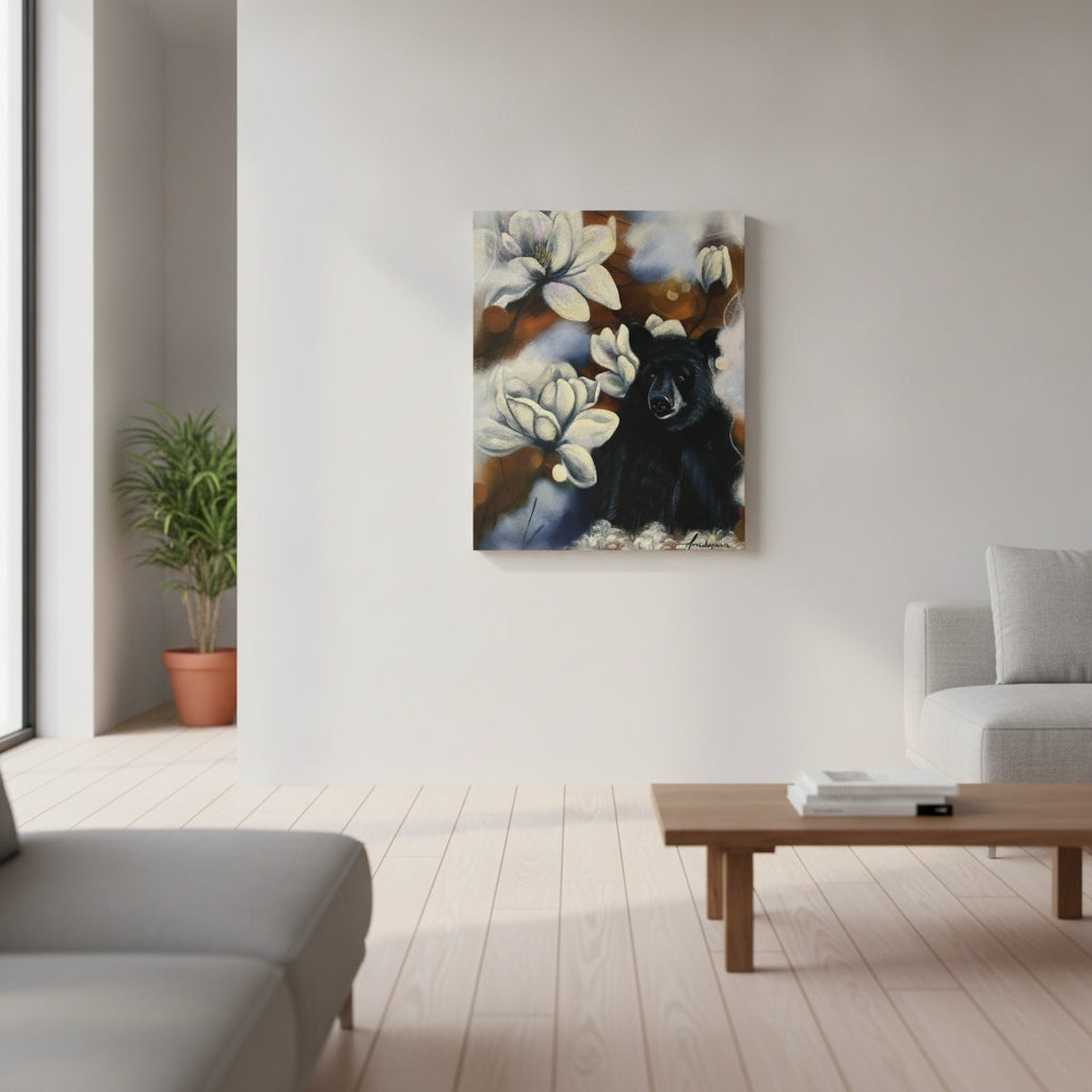 Feeling Small in a Big World — Canvas Print by Annikaprana, displayed on a white wall in a bright Scandinavian living room. Black bear with white magnolia flowers, giclée print on canvas with black 4 cm gallery wrap.
