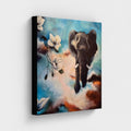 Canvas print "The Power of Stepping into the Light" by Annikaprana — gallery-wrapped canvas with black 4 cm border, showing an elephant emerging through clouds and white magnolia blossoms in shades of blue, terracotta and cream