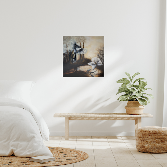 Sunshine After Rain 2026, original painting by Annikaprana. Mixed media artwork with a long-tailed tit in flight above white magnolia blossoms in a dark atmospheric landscape, displayed above a console table with a plant in a bright Scandinavian interior. Oil on canvas, 60×60 cm, gallery wrapped, ready to hang.