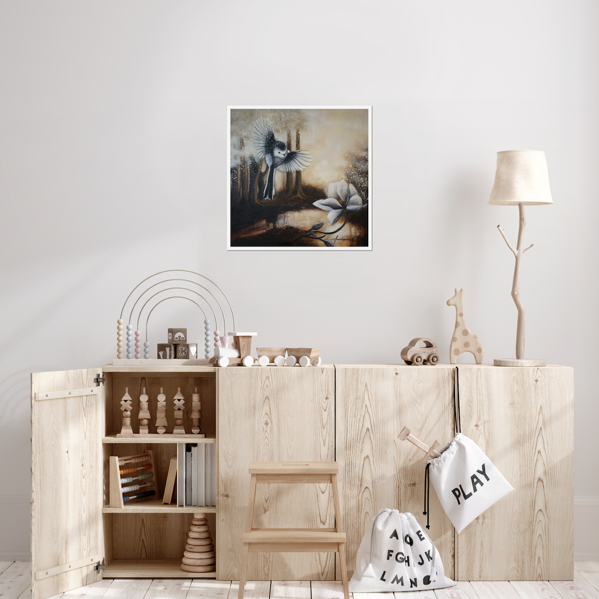 Sunshine After Rain 2026 — Fine Art Print by Annikaprana. A long-tailed tit in flight above a white magnolia in a misty golden forest. Small print displayed in a Scandinavian children's room. Giclée on Hahnemühle German Etching 310gsm, white border, ready to frame.