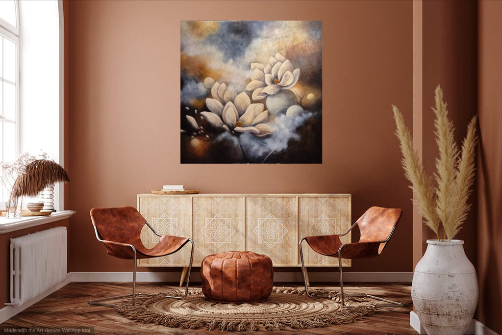 Magnolia wall art in living room setting – abstract oil painting with white magnolia flowers against a blue and golden background, displayed above a light wood sideboard in a bohemian room with terracotta walls.