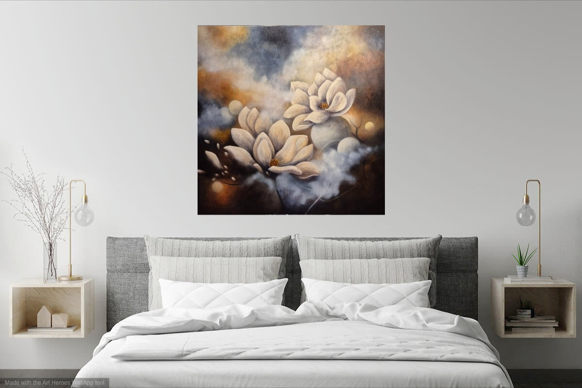Magnolia wall art in bedroom – abstract painting with white magnolia flowers hung above a double bed with white bedding in a warm, darker bedroom with beige walls.